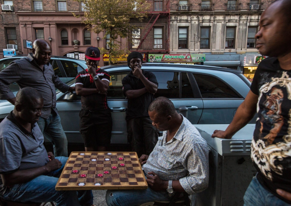 Men playing chess in street